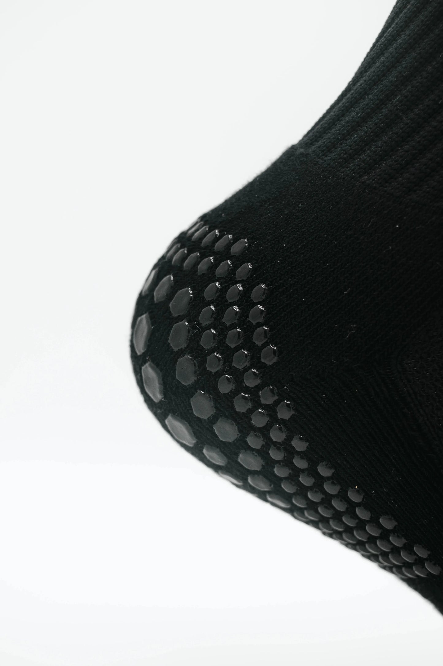Black GT GRIP Socks Heel Close-Up, Ultra-Thin Silicone Grip for Superior Traction and Stability